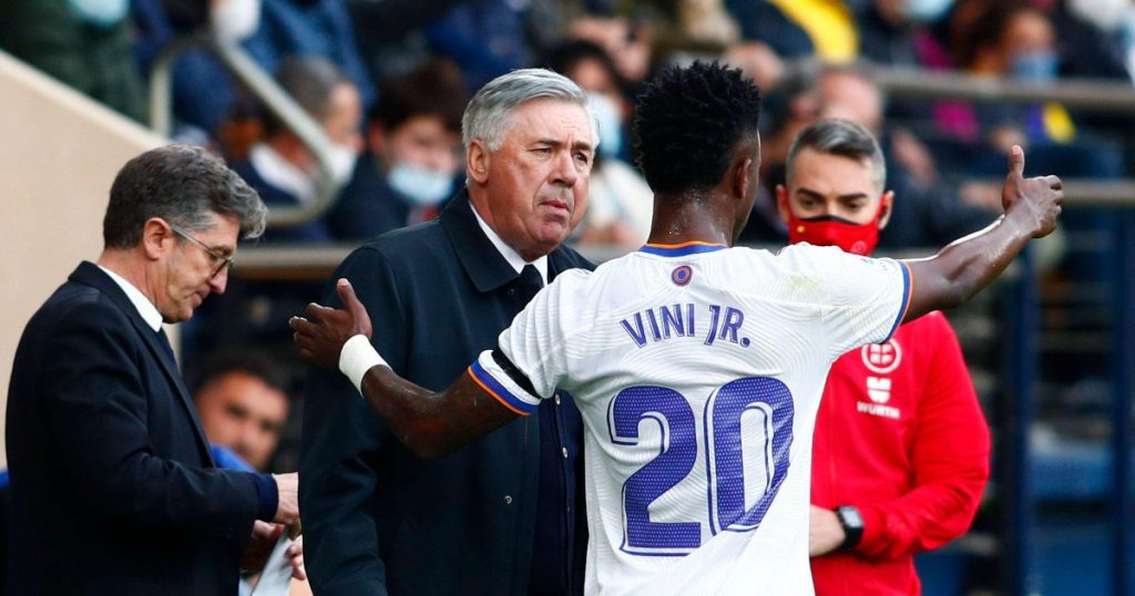 Carlo Ancelotti smiling on the sidelines